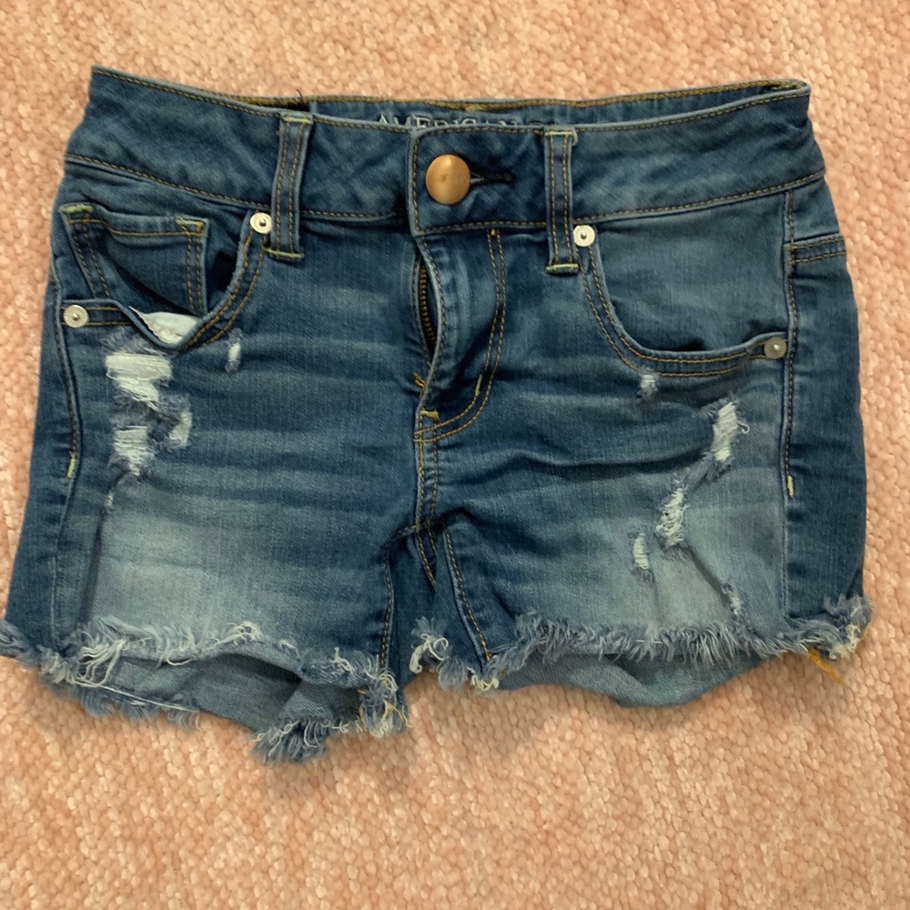 American eagle Jean shorts with rips in the legs